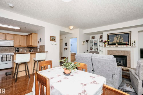 112 260 Sturgeon Road, St. Albert, AB - Indoor Photo Showing Dining Room With Fireplace