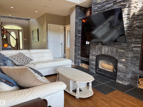 100 Aspen Drive, Athabasca Town, AB - Indoor Photo Showing Living Room With Fireplace