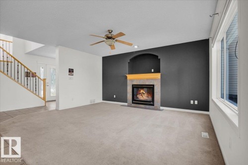 4074 33A Street, Edmonton, AB - Indoor Photo Showing Living Room With Fireplace