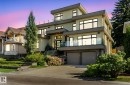 Contemporary home featuring stucco siding, concrete driveway, a balcony, an attached garage, and stairway - 11823 Saskatchewan Drive, Edmonton, AB  - Outdoor With Facade 