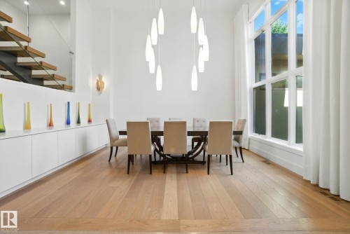 Dining area with light wood-type flooring - 11823 Saskatchewan Drive, Edmonton, AB - Indoor Photo Showing Dining Room