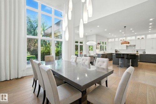 Dining space featuring light wood-style floors and recessed lighting - 11823 Saskatchewan Drive, Edmonton, AB - Indoor Photo Showing Dining Room
