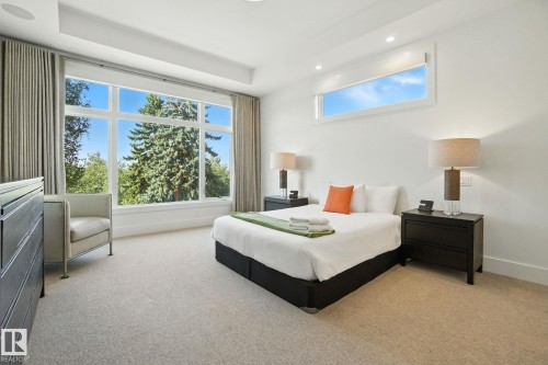 Bedroom with light colored carpet and recessed lighting - 11823 Saskatchewan Drive, Edmonton, AB - Indoor Photo Showing Bedroom