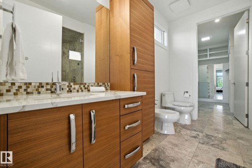 Bathroom with vanity, a shower stall, a bidet, and decorative backsplash - 11823 Saskatchewan Drive, Edmonton, AB - Indoor Photo Showing Bathroom