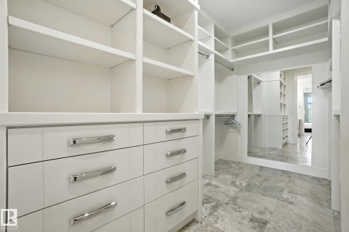 View of walk in closet - 11823 Saskatchewan Drive, Edmonton, AB - Indoor With Storage