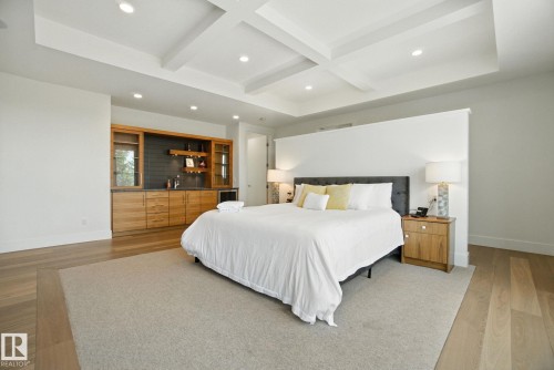 Bedroom with recessed lighting, beamed ceiling, light wood finished floors, and coffered ceiling - 11823 Saskatchewan Drive, Edmonton, AB - Indoor Photo Showing Bedroom