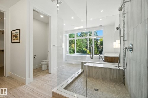 Bathroom with a shower stall, light tile patterned flooring, a soaking tub, and recessed lighting - 11823 Saskatchewan Drive, Edmonton, AB - Indoor Photo Showing Bathroom