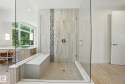 Bathroom with a shower stall, recessed lighting, and tile patterned flooring - 