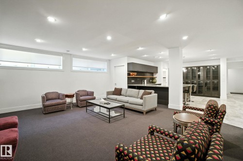 Carpeted living area with recessed lighting and baseboards - 11823 Saskatchewan Drive, Edmonton, AB - Indoor Photo Showing Other Room