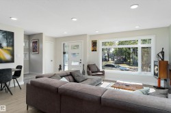 Living room with wood finished floors and recessed lighting - 