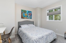 Bedroom featuring carpet flooring and baseboards - 