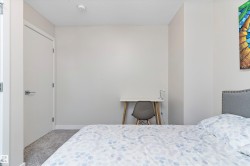 Carpeted bedroom featuring baseboards - 