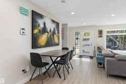 Dining space with light wood finished floors and recessed lighting - 