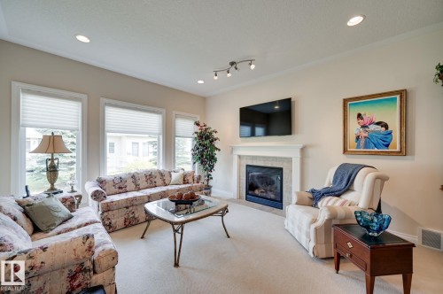 20 1225 Wanyandi Road, Edmonton, AB - Indoor Photo Showing Living Room With Fireplace