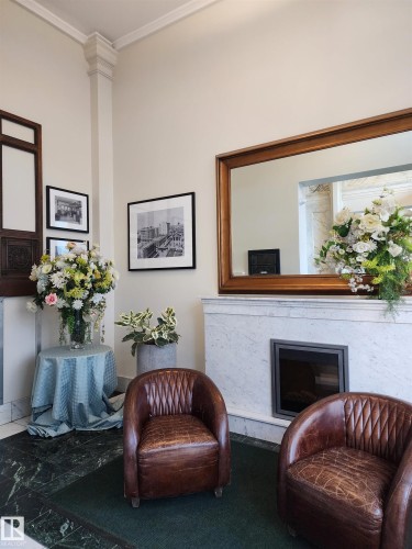 307 10134 100 Street, Edmonton, AB - Indoor Photo Showing Other Room With Fireplace