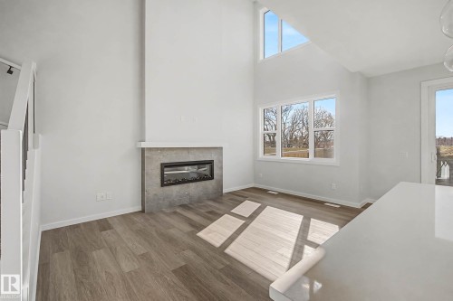 6923 51 Avenue, Beaumont, AB - Indoor Photo Showing Living Room With Fireplace