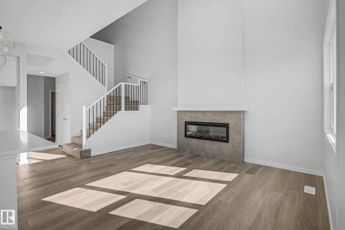 6923 51 Avenue, Beaumont, AB - Indoor Photo Showing Living Room With Fireplace