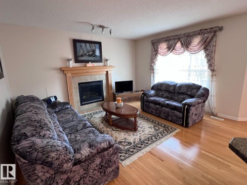 20707 56 Avenue, Edmonton, AB - Indoor Photo Showing Living Room With Fireplace