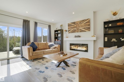 1138 Cy Becker Road, Edmonton, AB - Indoor Photo Showing Living Room With Fireplace