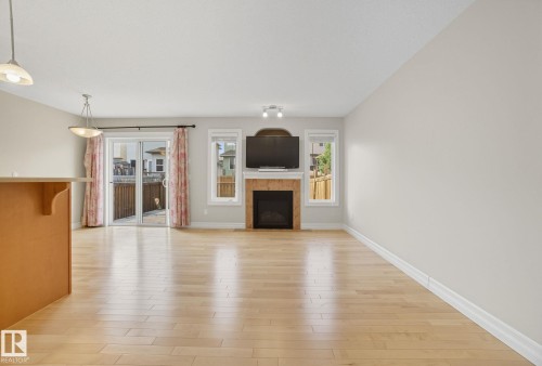 11611 17 Avenue, Edmonton, AB - Indoor Photo Showing Living Room With Fireplace