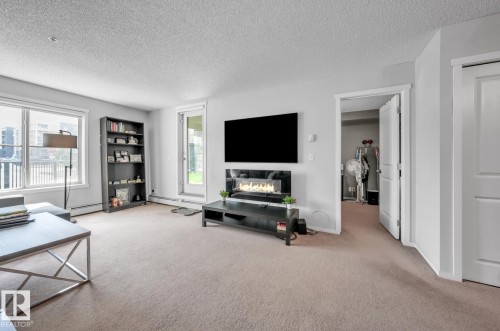 124 3315 James Mowatt Trail, Edmonton, AB - Indoor Photo Showing Living Room