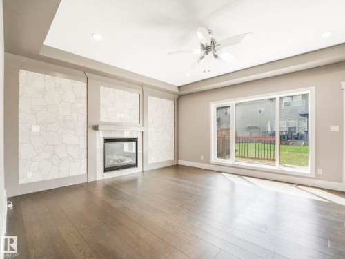 2421 Ashcraft Crescent, Edmonton, AB - Indoor Photo Showing Living Room With Fireplace