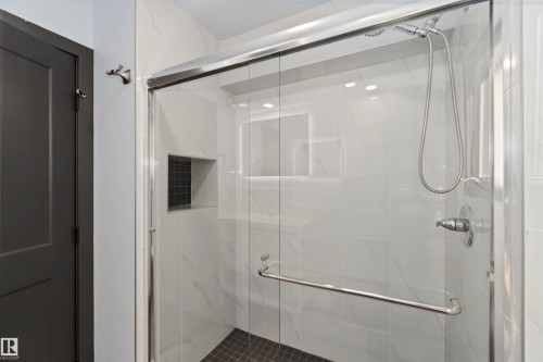 Bathroom with a marble finish shower - 6808 95 Avenue, Edmonton, AB - Indoor Photo Showing Bathroom