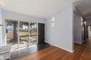 Entryway with dark wood-type flooring and baseboards - 6808 95 Avenue, Edmonton, AB  - Indoor Photo Showing Other Room 