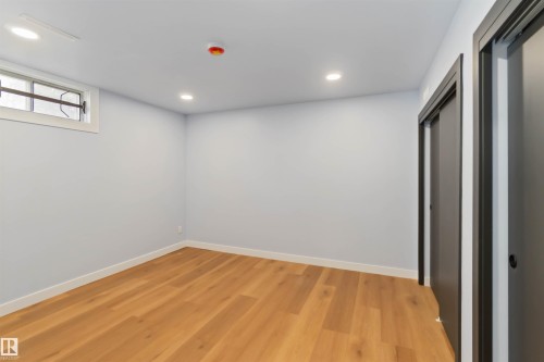 Basement with light wood finished floors and recessed lighting - 6808 95 Avenue, Edmonton, AB - Indoor Photo Showing Other Room