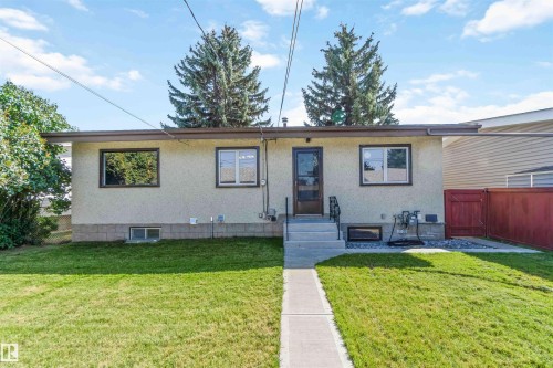 View of front of house featuring stucco siding and a gate - 6808 95 Avenue, Edmonton, AB - Outdoor