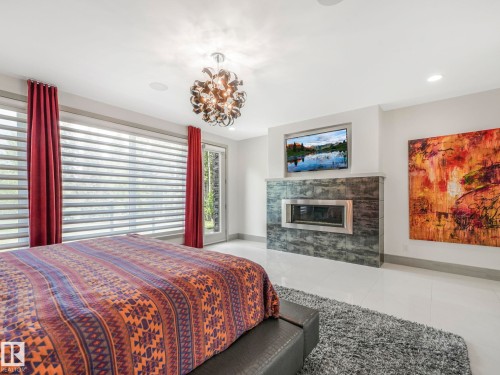 26 51222 Rge Road 260, Rural Parkland County, AB - Indoor Photo Showing Bedroom With Fireplace