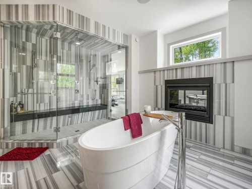 26 51222 Rge Road 260, Rural Parkland County, AB - Indoor Photo Showing Bathroom With Fireplace