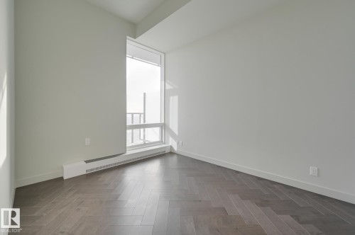 Spare room featuring baseboards and a baseboard radiator - 4503 10360 102 Nw, Edmonton, AB - Indoor Photo Showing Other Room