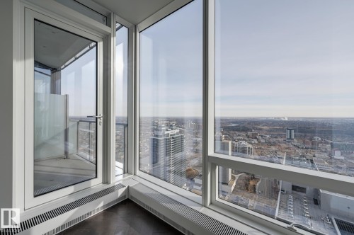 Unfurnished sunroom featuring a view of city - 4503 10360 102 Nw, Edmonton, AB - Indoor Photo Showing Other Room
