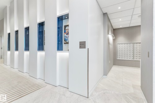 Corridor with mail area, recessed lighting, light marble finish floors, and a paneled ceiling - 4503 10360 102 Nw, Edmonton, AB - Indoor Photo Showing Other Room