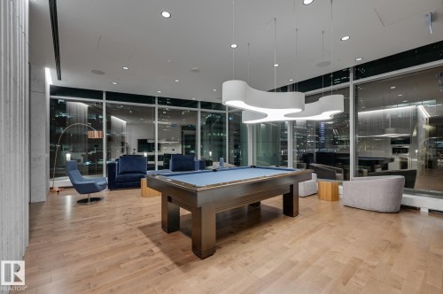 Recreation room featuring billiards, light wood-style floors, expansive windows, and recessed lighting - 4503 10360 102 Nw, Edmonton, AB - Indoor Photo Showing Other Room