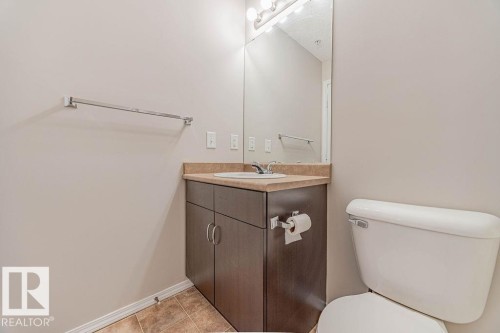 Bathroom with vanity and light tile patterned floors - Edmonton, AB - Indoor Photo Showing Bathroom