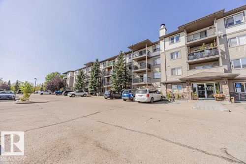 View of apartment building / complex featuring uncovered parking - Edmonton, AB - Outdoor