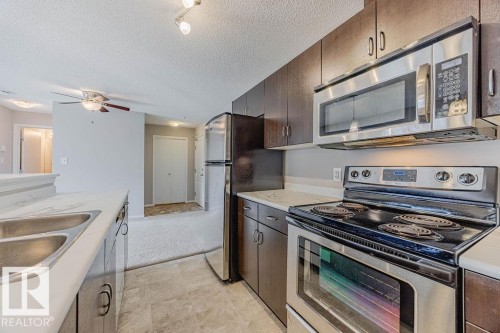 Edmonton, AB - Indoor Photo Showing Kitchen With Stainless Steel Kitchen With Double Sink