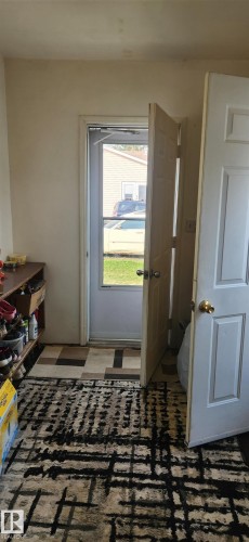 Doorway to outside with brick floors - 5002 - 50 Avenue, Dapp, AB - Indoor Photo Showing Other Room