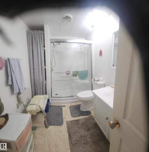 Bathroom featuring a shower stall and vanity - 5002 - 50 Avenue, Dapp, AB - Indoor Photo Showing Bathroom