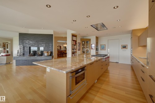 28 Riverside Crescent, Edmonton, AB - Indoor Photo Showing Kitchen With Fireplace With Upgraded Kitchen