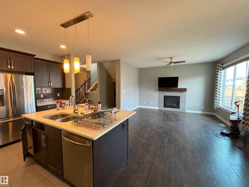 17615 77 Street, Edmonton, AB - Indoor Photo Showing Kitchen With Fireplace With Double Sink