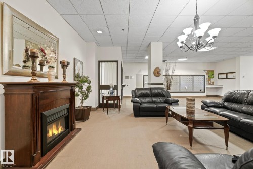 1910 10149 Saskatchewan Drive, Edmonton, AB - Indoor Photo Showing Living Room With Fireplace