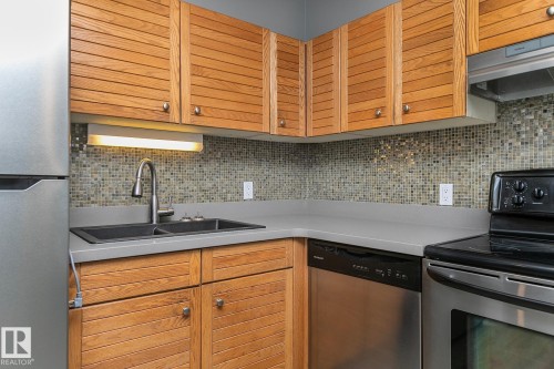 1910 10149 Saskatchewan Drive, Edmonton, AB - Indoor Photo Showing Kitchen With Double Sink