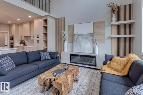 3612 Triomphe Boulevard, Beaumont, AB - Indoor Photo Showing Living Room With Fireplace