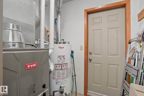 Utilities with gas water heater and heating unit - 6309 49 St, Rural Wetaskiwin County, AB - Indoor Photo Showing Basement
