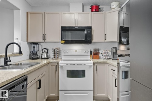 209 11615 Ellerslie Road, Edmonton, AB - Indoor Photo Showing Kitchen With Double Sink