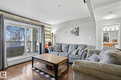 209 11615 Ellerslie Road, Edmonton, AB - Indoor Photo Showing Living Room