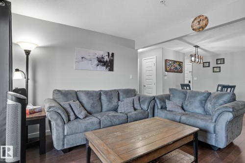 209 11615 Ellerslie Road, Edmonton, AB - Indoor Photo Showing Living Room